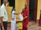 Distributes dry ration packs among Buddhist Temples
